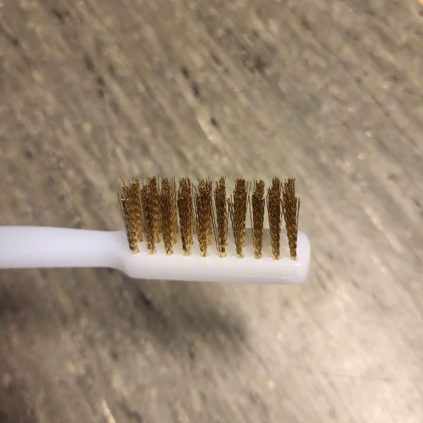 Hand-held brass brush