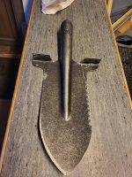 Multifunctional entrenching shovel